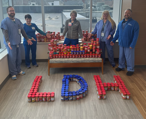 Employees with stacks of peanut butter